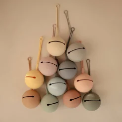 Mushie Pacifier Holder Hot